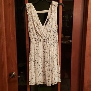 Sleeveless white dress with sequin details